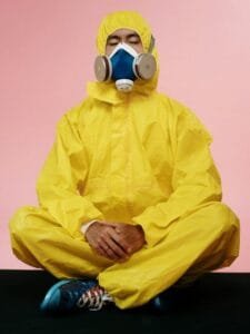 low immunity man wearing PIP kit and gas mask